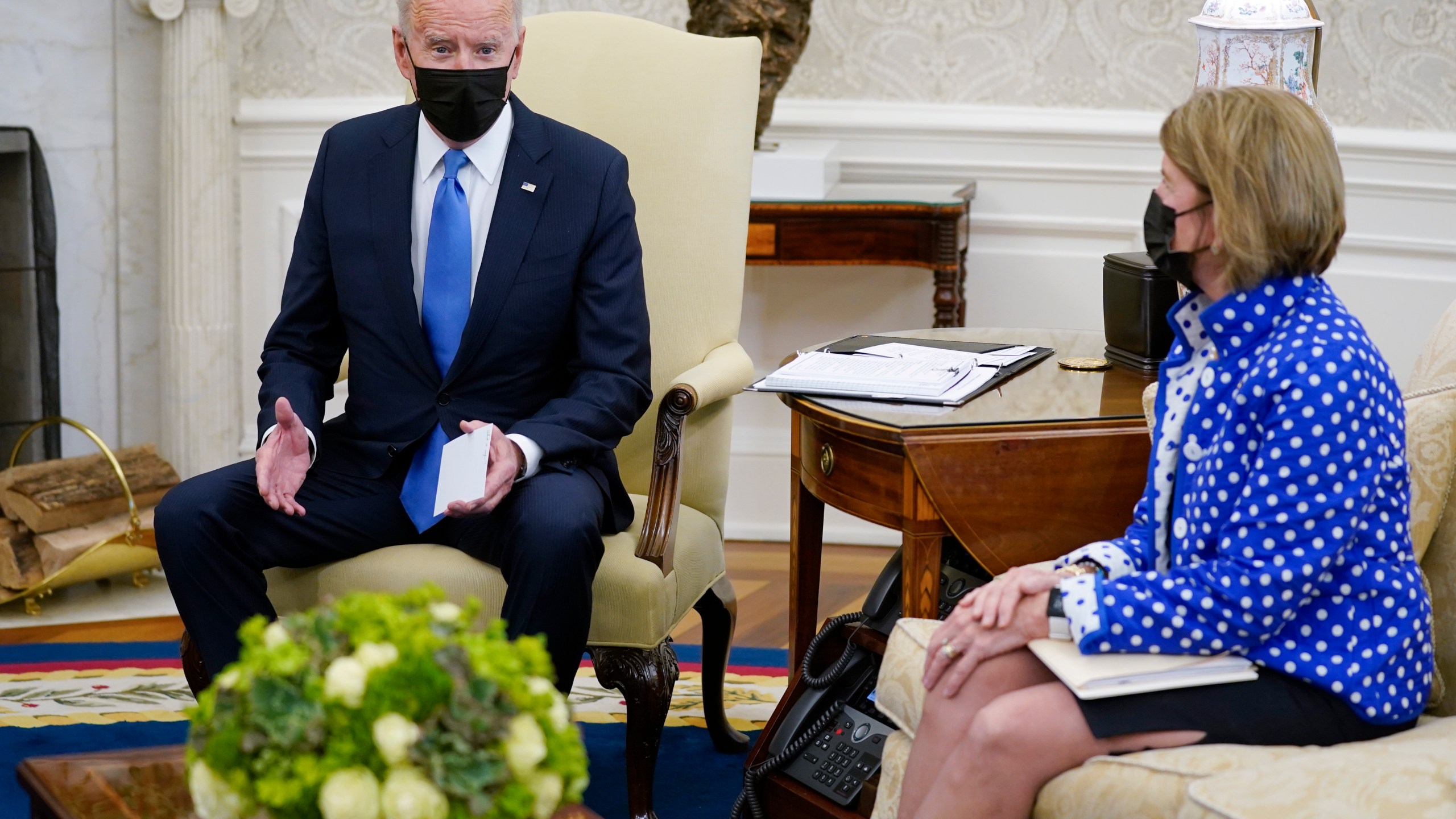 Sen. Shelley Moore Capito, R-W.Va., right, listens as President Joe Biden speaks during a meeting with Republican Senators in the Oval Office of the White House, Thursday, May 13, 2021, in Washington. (AP Photo/Evan Vucci)