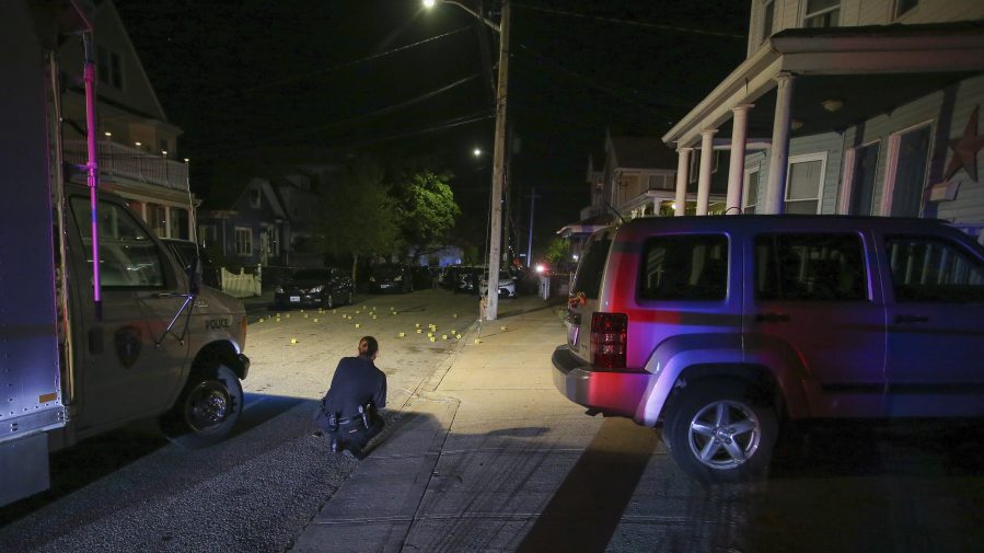 Providence police investigate a shooting on May 13, 2021, in Providence, R.I. (Stew Milne / Associated Press)