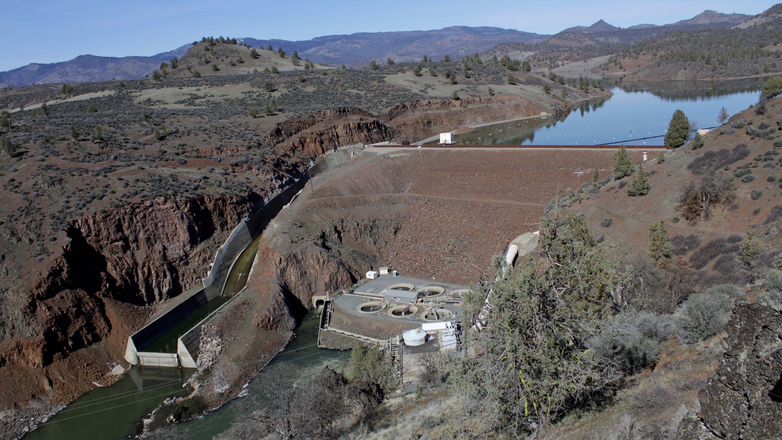 In this March 3, 2020, file photo, is the Iron Gate Dam, powerhouse and spillway are on the lower Klamath River near Hornbrook, Calif. (AP Photo/Gillian Flaccus, File)