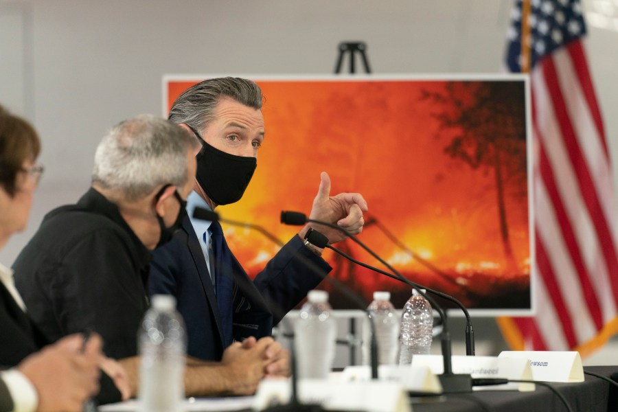 California Gov. Gavin Newsom speaks about wildfires during a briefing with then President Donald Trump at Sacramento McClellan Airport in McClellan Park, Calif., on Sept. 14, 2020. (Andrew Harnik / Associated Press)