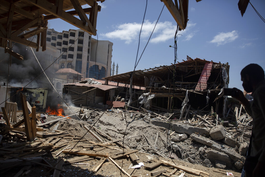 Smoke and fire rises from a beachside cafe after it was hit by an Israeli airstrike, in Gaza City, Monday, May 17, 2021. (AP Photo/Khalil Hamra)