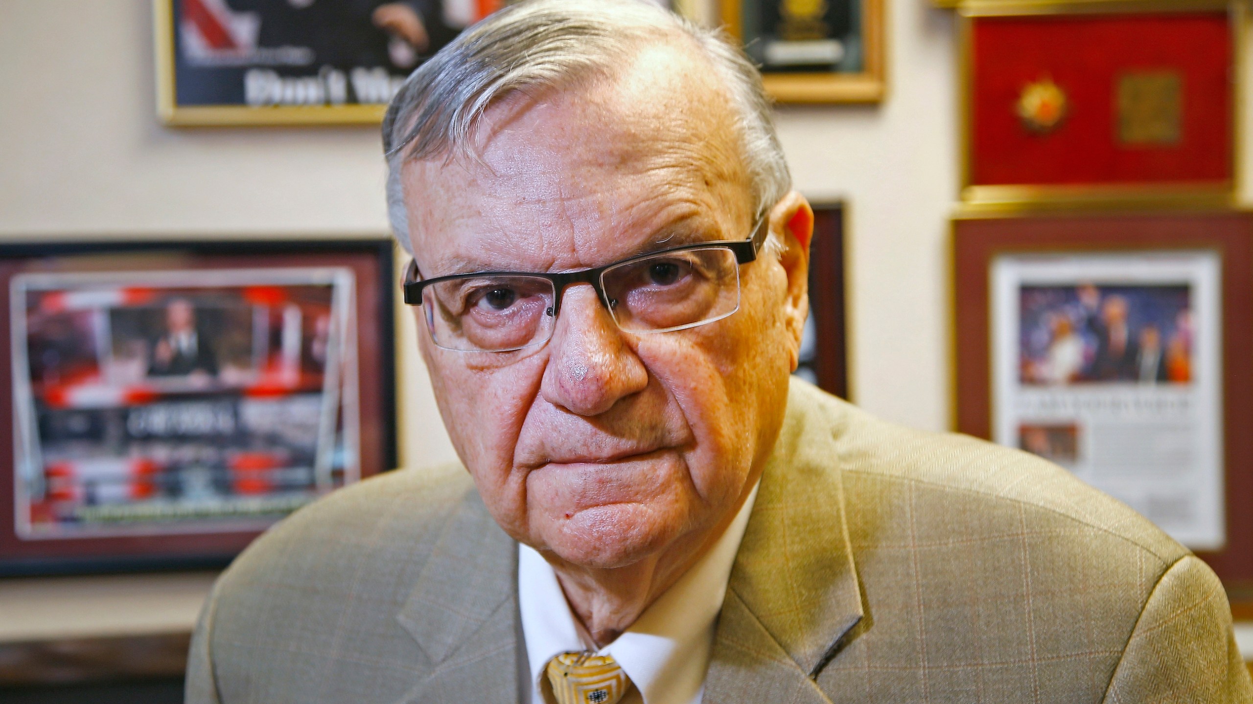 In this Aug. 26, 2019, file photo, former Maricopa County Sheriff Joe Arpaio poses for a portrait at his private office in Fountain Hills, Arizona. The taxpayer costs for the racial profiling lawsuit stemming from the immigration patrols launched a decade ago by Arpaio are expected to reach $202 million by the summer of 2022. Officials approved a tentative county budget Monday, May 17, 2021, that provides $31 million for compliance costs in the fiscal year that begins on July 1. No one in county government can say exactly when those costs will start to decline or end. (AP Photo/Ross D. Franklin, File)