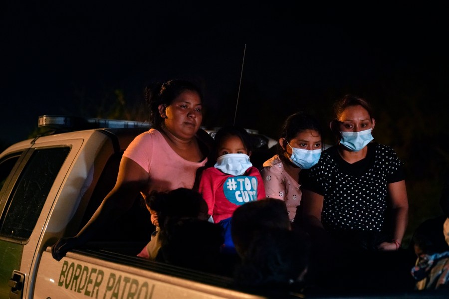 Migrants from Honduras wait in a Border Patrol truck after turning themselves in upon crossing the U.S.-Mexico border in La Joya, Texas, on May 17, 2021. (Gregory Bull / Associated Press)