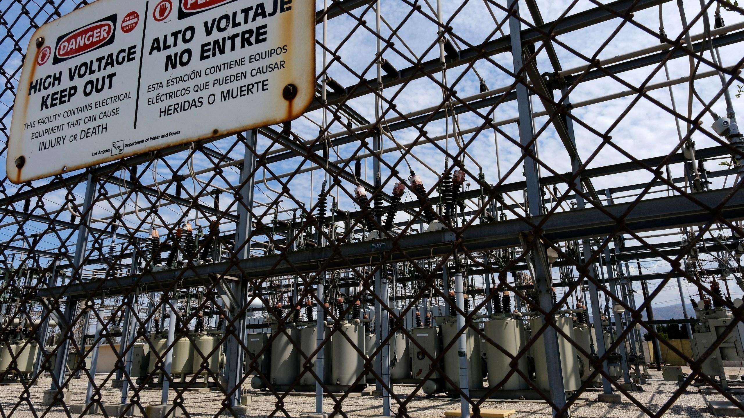 In this Aug. 15, 2020 file photo high voltage signs are posted on the Department of Water and Power Sub Station E in North Hollywood. (Richard Vogel/Associated Press)