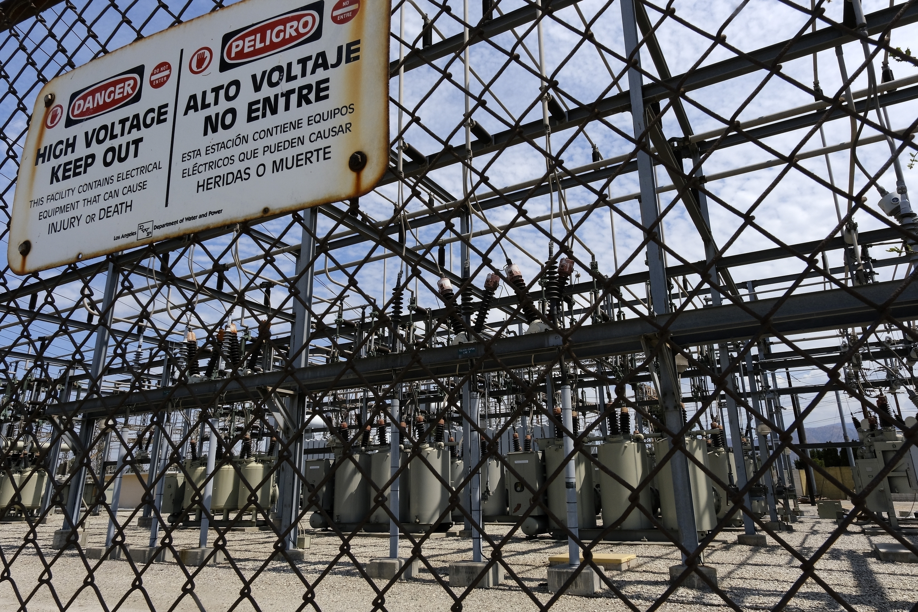 In this Aug. 15, 2020 file photo high voltage signs are posted on the Department of Water and Power Sub Station E in North Hollywood. (Richard Vogel/Associated Press)