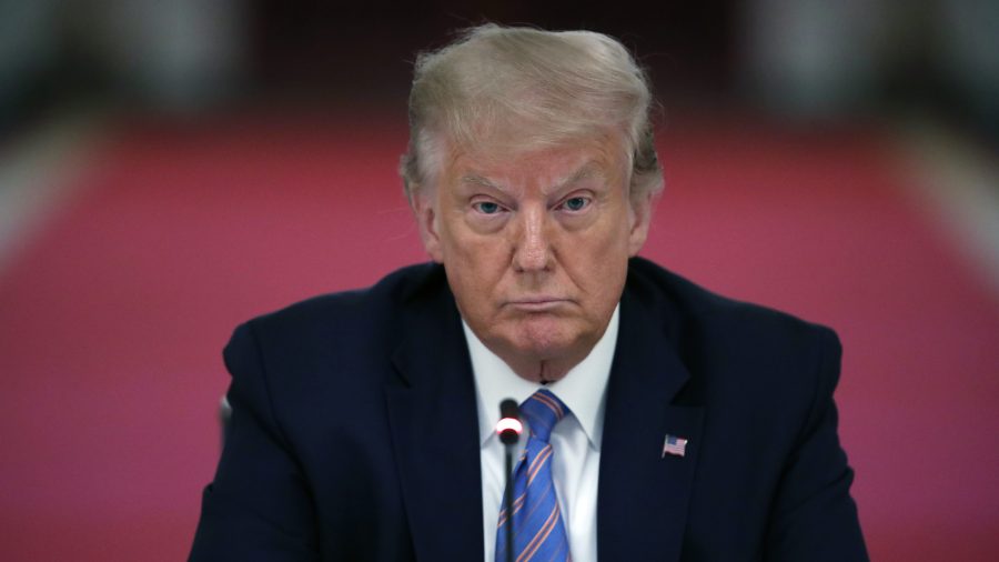 President Donald Trump listens during a "National Dialogue on Safely Reopening America's Schools" event in the East Room of the White House on July 7, 2020. (Alex Brandon / Associated Press)