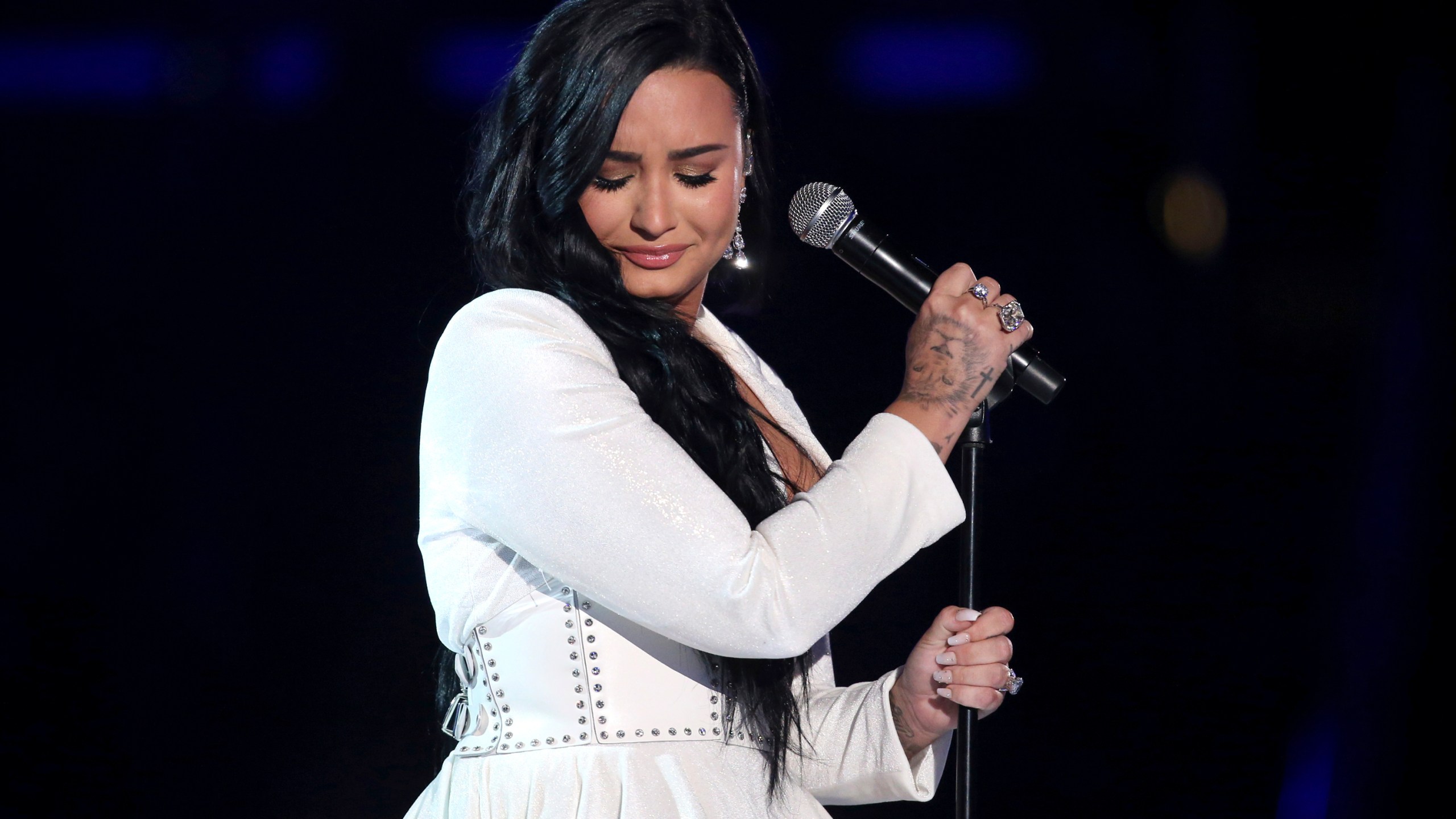 Demi Lovato performs "Anyone" at the 62nd annual Grammy Awards on Jan. 26, 2020, in Los Angeles. Lovato revealed on May 19, 2021 they identify as nonbinary and are changing their pronouns, telling fans the decision came after “self-reflective work.” (Matt Sayles/Invision/AP, File)