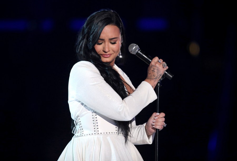 Demi Lovato performs "Anyone" at the 62nd annual Grammy Awards on Jan. 26, 2020, in Los Angeles. Lovato revealed on May 19, 2021 they identify as nonbinary and are changing their pronouns, telling fans the decision came after “self-reflective work.” (Matt Sayles/Invision/AP, File)