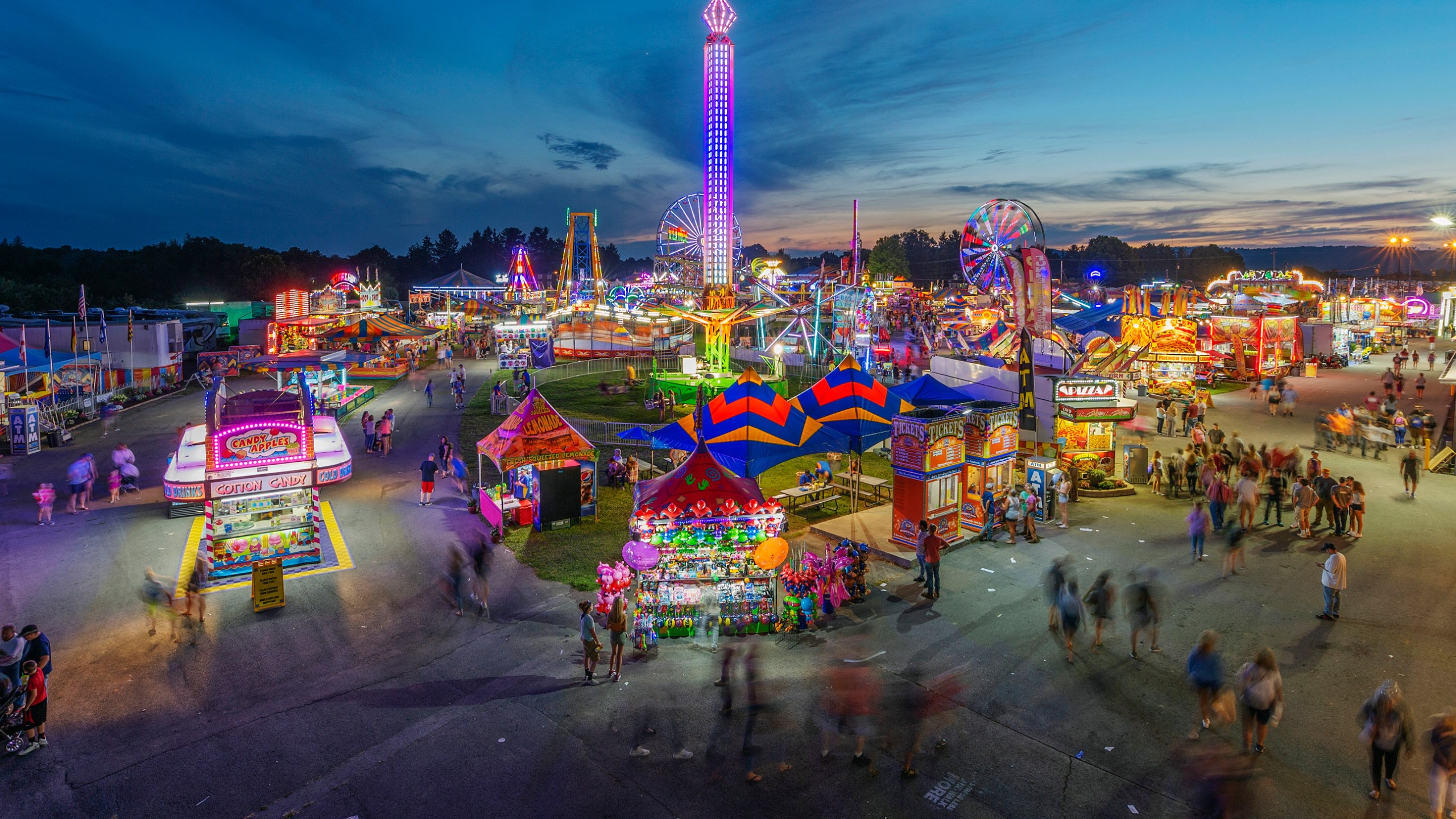 In this Aug. 9, 2018, file photo, fair-goers attend The State Fair of West Virginia at the State Fairgrounds in Fairlea, W.Va. West Virginia has seen a higher percentage of residents depart than any other state in the past decade. (Craig Hudson/Charleston Gazette-Mail via AP, File)