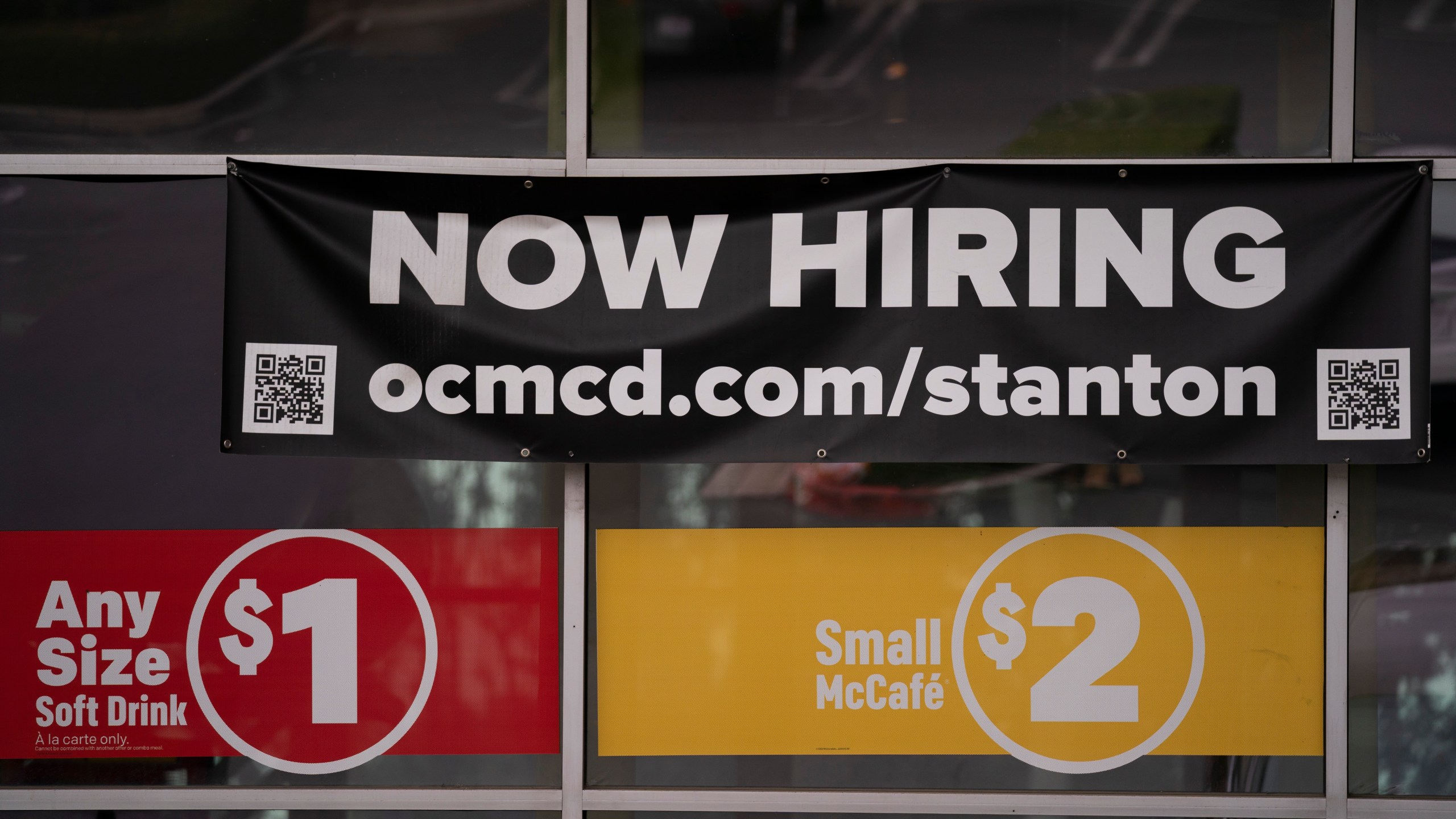 In this May 17, 2021, file photo, a hiring banner hangs outside a McDonald's fast-food restaurant in Stanton, Calif. (AP Photo/Jae C. Hong, File)