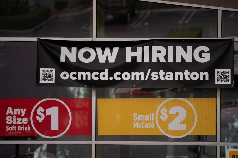 In this May 17, 2021, file photo, a hiring banner hangs outside a McDonald's fast-food restaurant in Stanton, Calif. (AP Photo/Jae C. Hong, File)