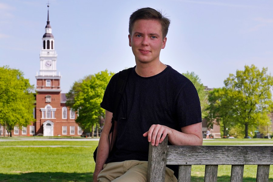 Colin Goodbred, a 22-year-old transgender student, poses on the campus of Dartmouth College, Friday, May 21, 2021, in Hanover, N.H. (AP Photo/Charles Krupa)