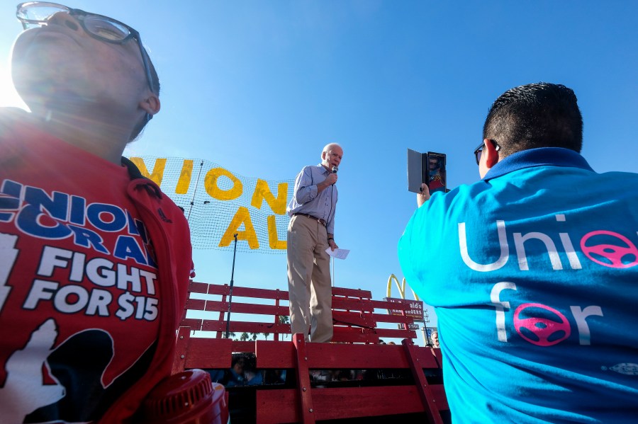 In this Dec. 19, 2019, file photo Democratic presidential candidate former Vice President Joe Biden, speaks at a rally in support of McDonald's cooks and cashiers who are demanding higher wages and union rights, outside a McDonald's restaurant in Los Angeles. (AP Photo/Ringo H.W. Chiu, File)