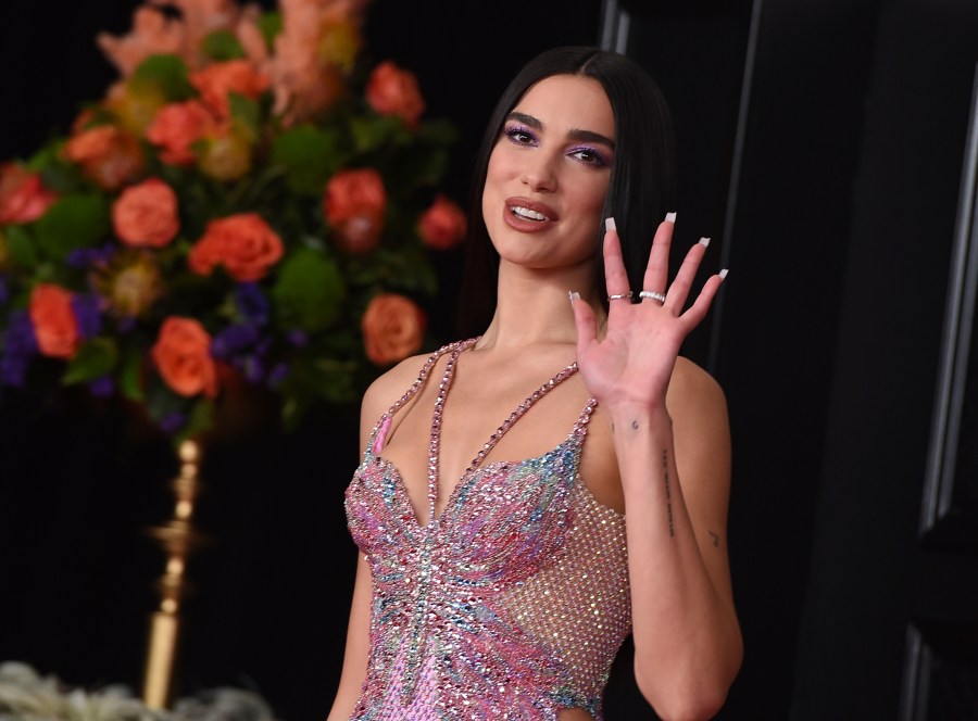 In this Sunday, March 14, 2021 file photo, Dua Lipa arrives at the 63rd annual Grammy Awards at the Los Angeles Convention Center. Singer Dua Lipa is blasting the organization which paid for a full-page ad in The New York Times that called her antisemitic for her support of Palestinians, saying it used her name “shamelessly” to “advance their ugly campaign with falsehoods and blatant misrepresentations.” Lipa took to Twitter on Saturday, May 22, 2021 to “reject the false and appalling allegations” and said the World Values Network twisted what she stands for. “I stand in solidarity with all oppressed people and reject all forms of racism,” she wrote. (Photo by Jordan Strauss/Invision/AP, File)