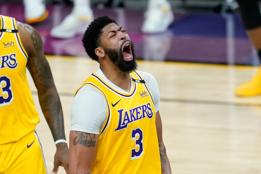 Los Angeles Lakers forward Anthony Davis shouts as he celebrates a stop against the Phoenix Suns during the second half of Game 2 of an NBA basketball first-round playoff series on May 25, 2021, in Phoenix. The Lakers defeated the Suns 109-102. (AP Photo/Ross D. Franklin)