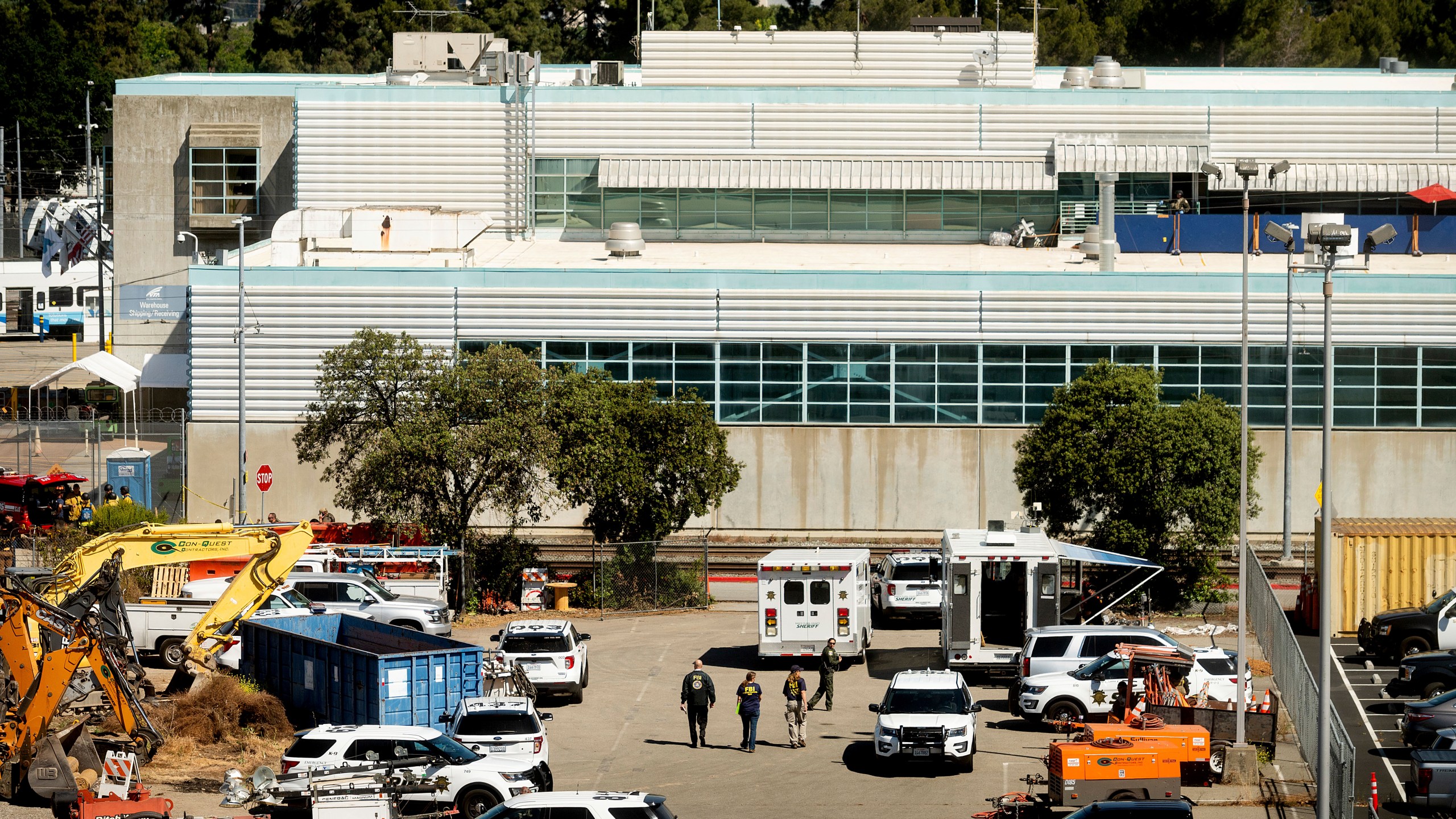 Law enforcement officers respond to the scene of a shooting at a Santa Clara Valley Transportation Authority (VTA) facility on Wednesday, May 26, 2021, in San Jose, Calif. Santa Clara County sheriff's spokesman said the rail yard shooting left multiple people, including the shooter, dead. (AP Photo/Noah Berger)