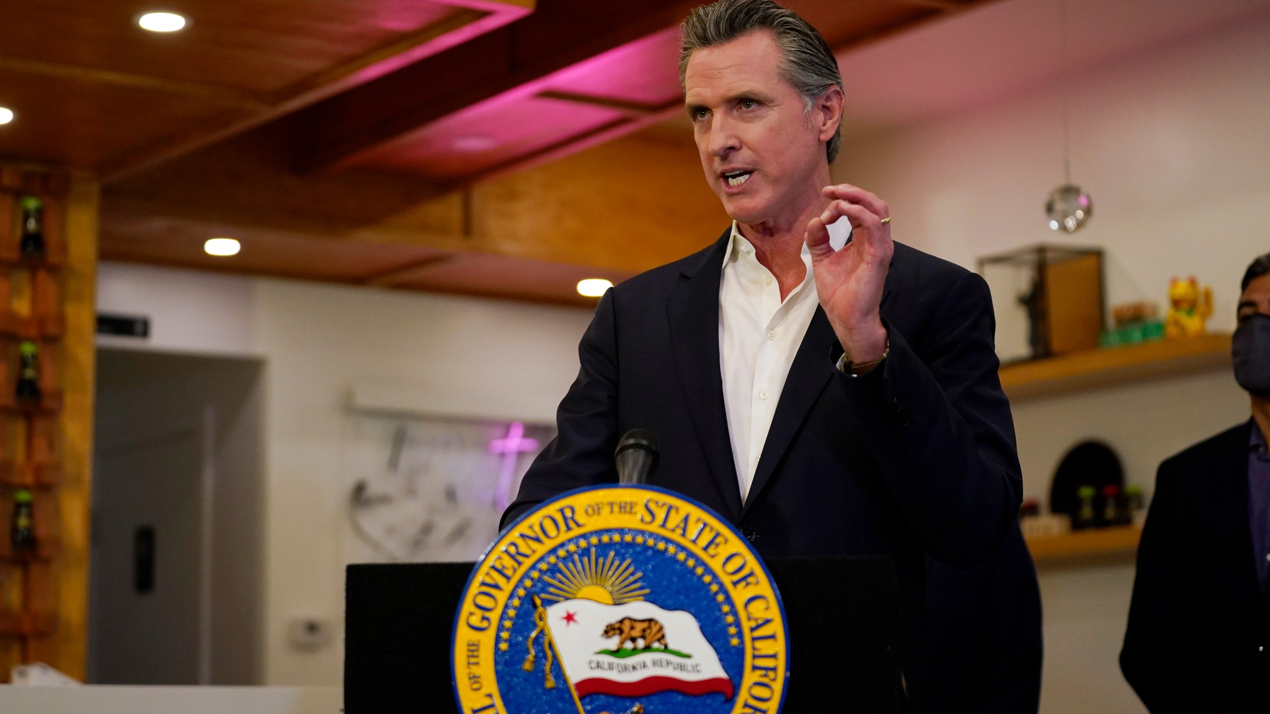 California Gov. Gavin Newsom speaks at Hanzo Sushi Thursday, April 29, 2021, in San Fernando, Calif. Businesses could be spared billions of dollars of higher taxes in coming years as a result of federal coronavirus relief funds flowing to the states. Newsom announced a budget plan this spring that would use $1.1 billion from the latest federal COVID-19 relief law to bolster a depleted unemployment compensation accounts. (AP Photo/Marcio Jose Sanchez, file)