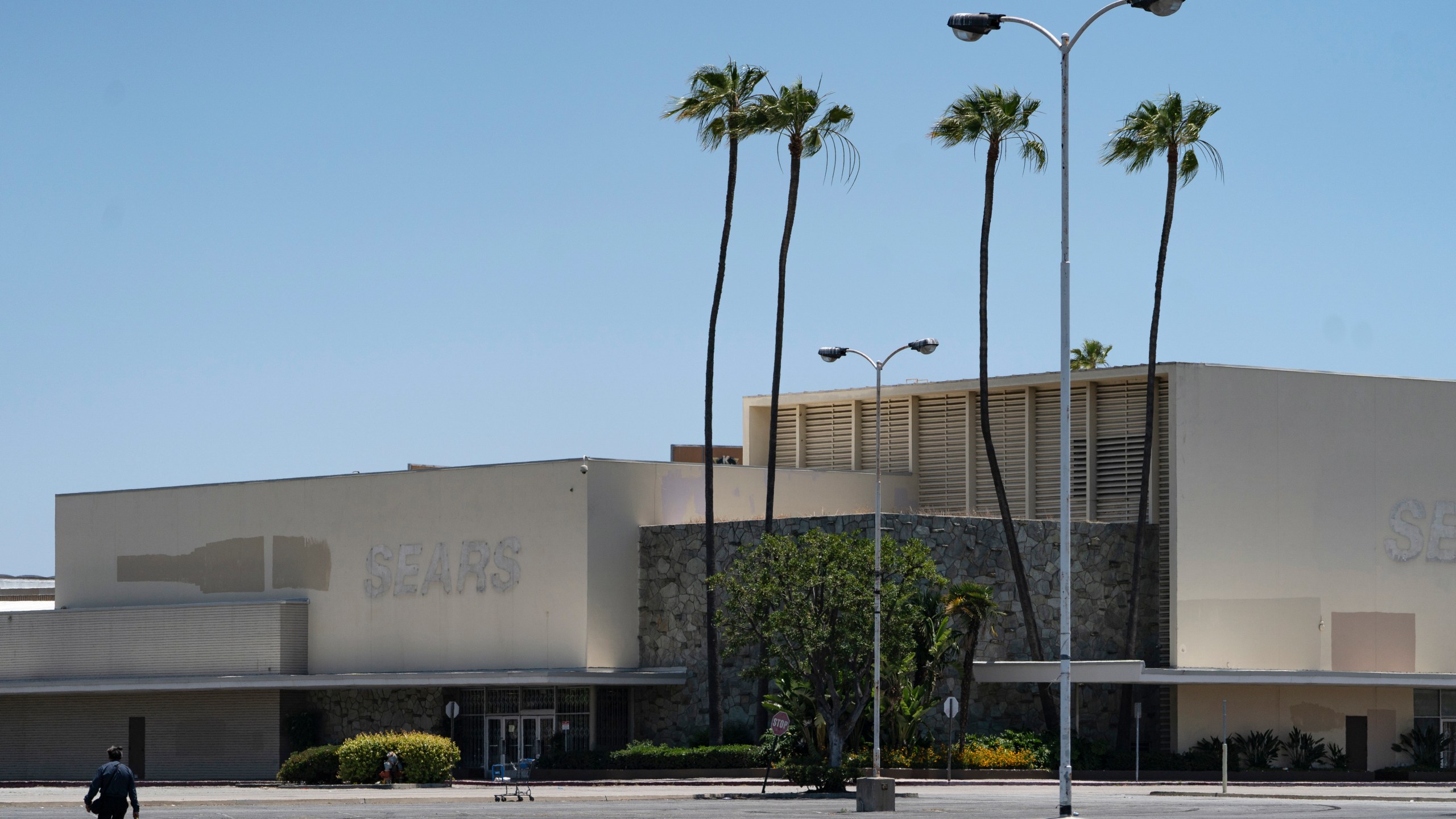 This Thursday, May 27, 2021, photo shows the closed Sears in Buena Park Mall in Buena Park, Calif. (AP Photo/Damian Dovarganes)