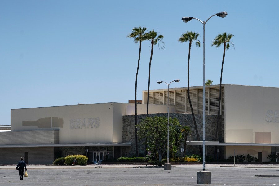 This Thursday, May 27, 2021, photo shows the closed Sears in Buena Park Mall in Buena Park, Calif. (AP Photo/Damian Dovarganes)