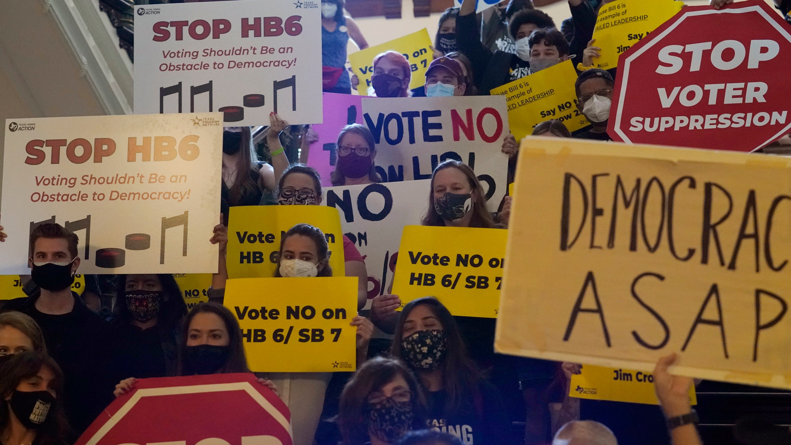 In this May 6, 2021 file photo, a group opposing new voter legislation gather outside the House Chamber at the Texas Capitol in Austin, Texas. Texas Republicans dug in Saturday, May 29, for a final weekend vote on some of the most restrictive new voting laws in the U.S., finalizing a sweeping bill that would eliminate drive-thru voting, reduce polling hours and scale back Sunday voting, when many Black churchgoers head to the polls.(AP Photo/Eric Gay, File)