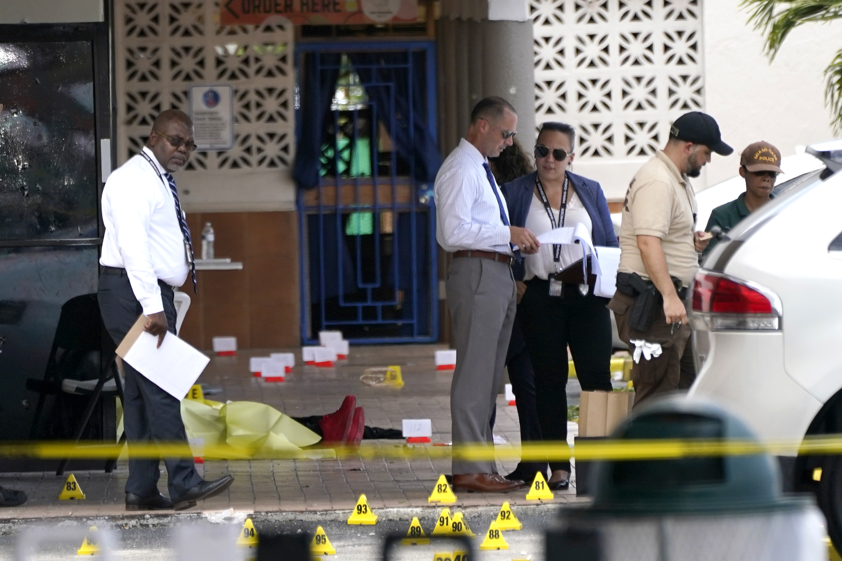 Law enforcement officials work the scene of a shooting outside a banquet hall near Hialeah, Fla. on May 30, 2021. (Lynne Sladky/Associated Press)