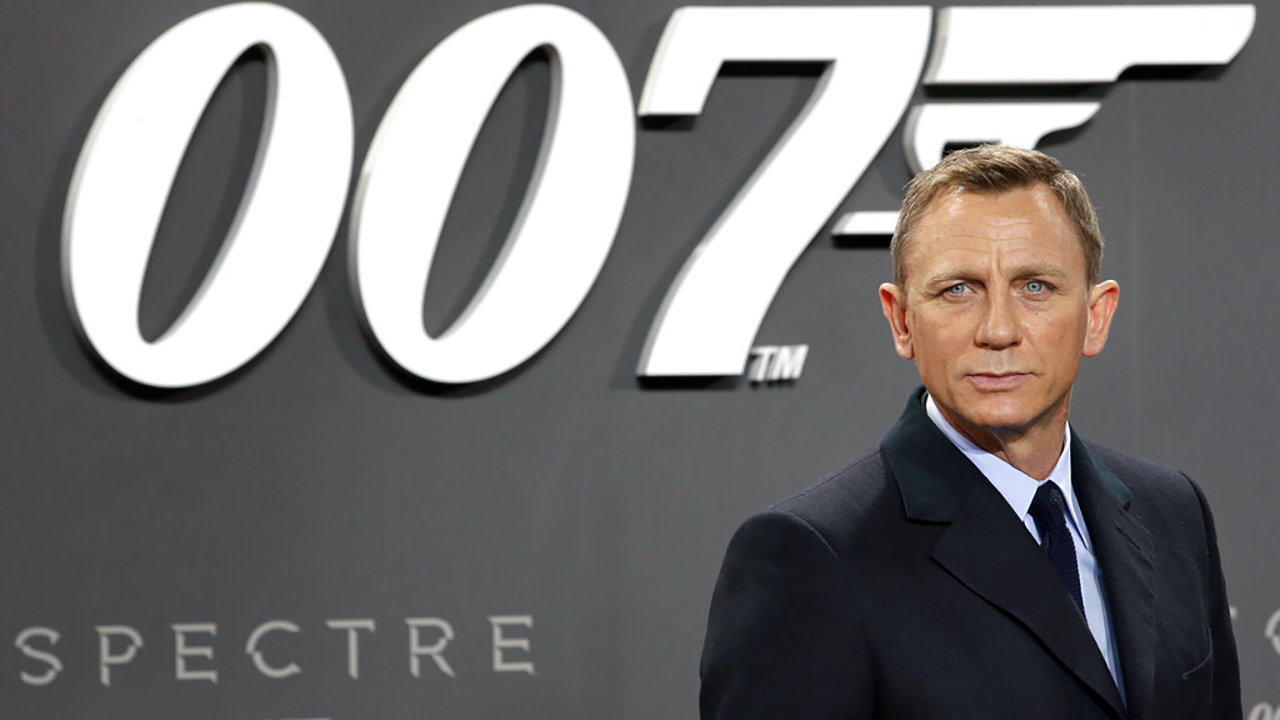 In this Oct. 28, 2015, file photo, actor Daniel Craig poses for the media as he arrives for the German premiere of the James Bond movie 'Spectre' in Berlin, Germany. Amazon, on Wednesday, May 26, 2021, is buying MGM, the movie and TV studio behind James Bond, “Legally Blonde” and “Shark Tank,” with the hopes of filling its video streaming service with more stuff to watch. (AP Photo/Michael Sohn, File)