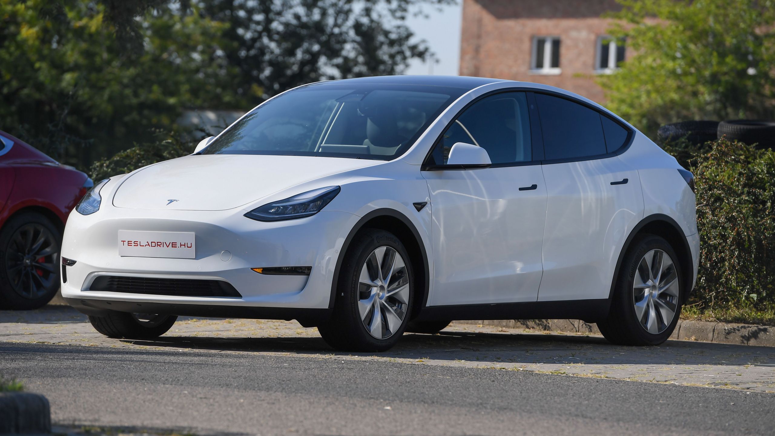 A Tesla Model Y car, an all-electric compact SUV, is seen during its presentation at the Automobile Club in Budapest on Sept. 5, 2020. (ATTILA KISBENEDEK / AFP / Getty Images)