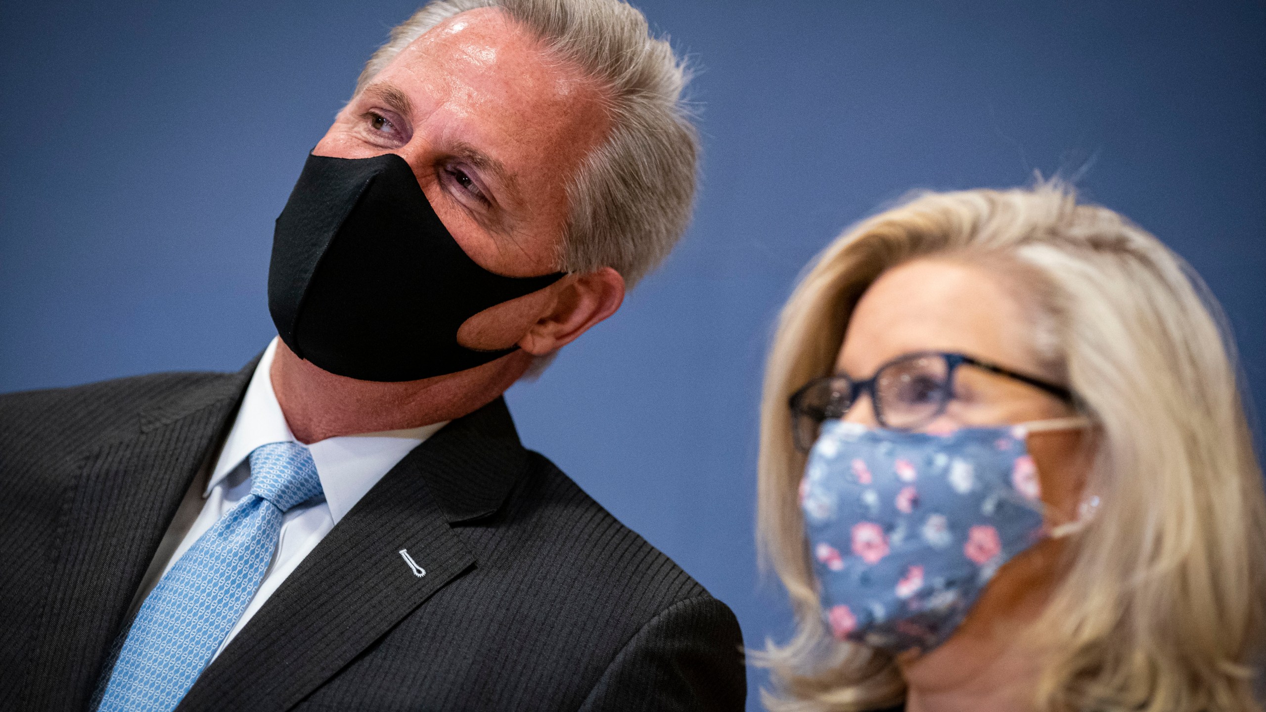 House Minority Leader Kevin McCarthy (R-CA) whispers to Rep. Liz Cheney (R-WY) during a House Republican Leadership news conference in the U.S. Capitol on February 24, 2021. (Al Drago/Getty Images)