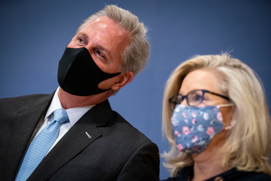 House Minority Leader Kevin McCarthy (R-CA) whispers to Rep. Liz Cheney (R-WY) during a House Republican Leadership news conference in the U.S. Capitol on February 24, 2021. (Al Drago/Getty Images)