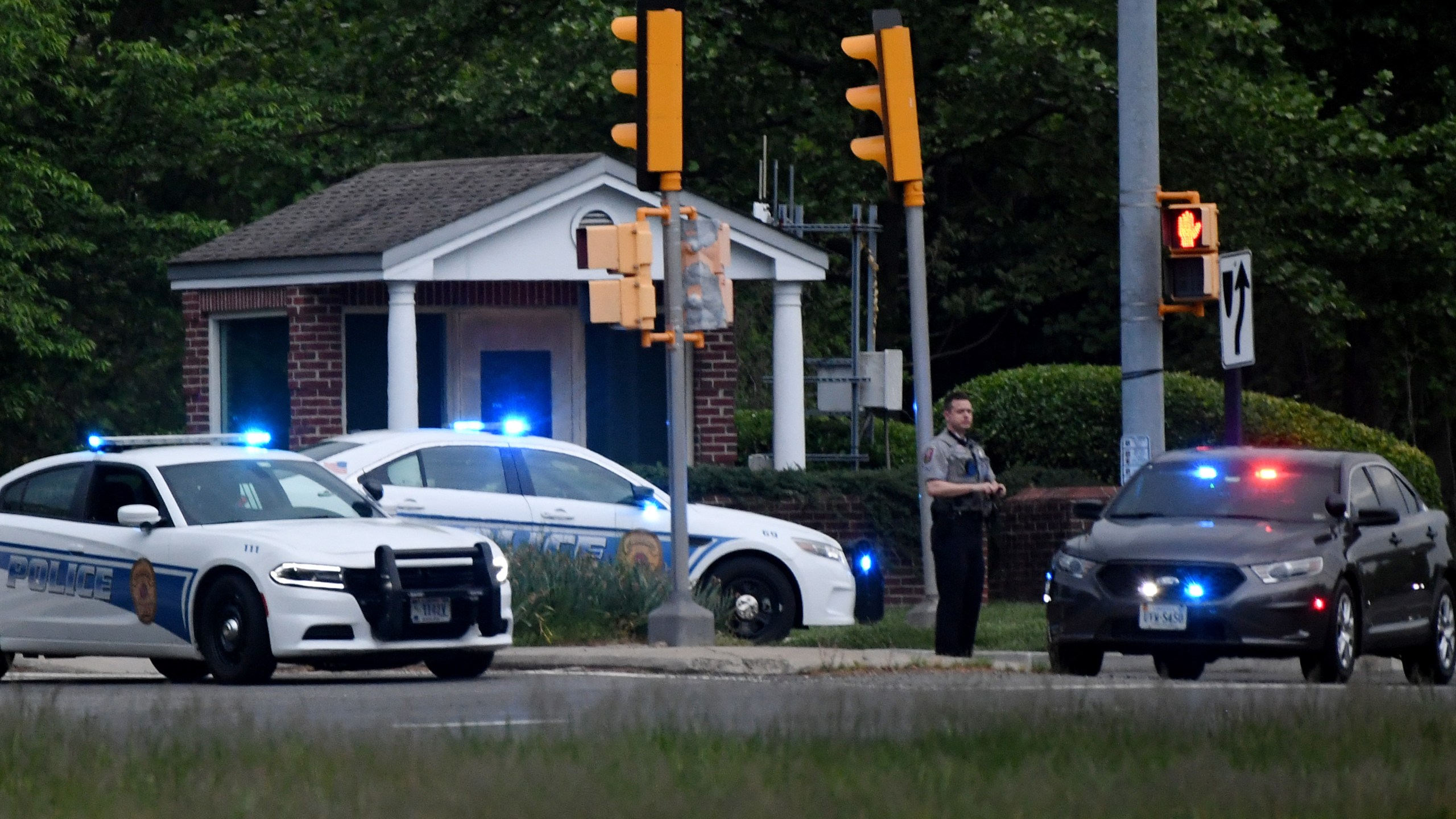 Police cars are seen outside the CIA headquarters' gate after an attempted intrusion earlier in the day in Langley, Virginia, on May 3, 2021. (Olivier Douliery / AFP / Getty Images)