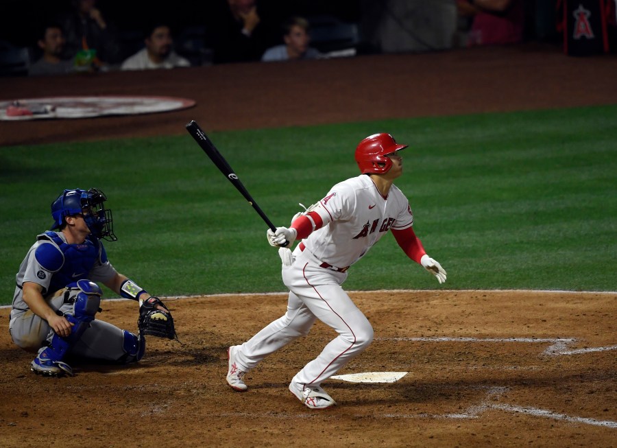 Shohei Ohtani #17 of the Los Angeles Angels hits an RBI double to score David Fletcher #22 during the sixth inning against relief pitcher Joe Kelly #17 of the Los Angeles Dodgers at Angel Stadium in Anaheim on May 7, 2021. (Kevork Djansezian / Getty Images)