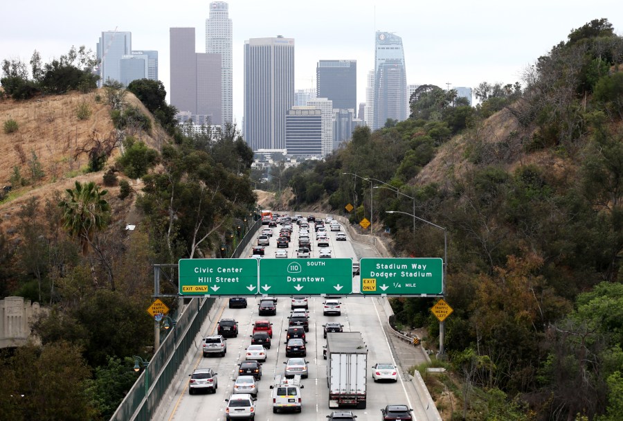 Cars make their way toward downtown L.A. on the 110 freeway during the morning commute on April 22, 2021 in Los Angeles, California. (Mario Tama/Getty Images)