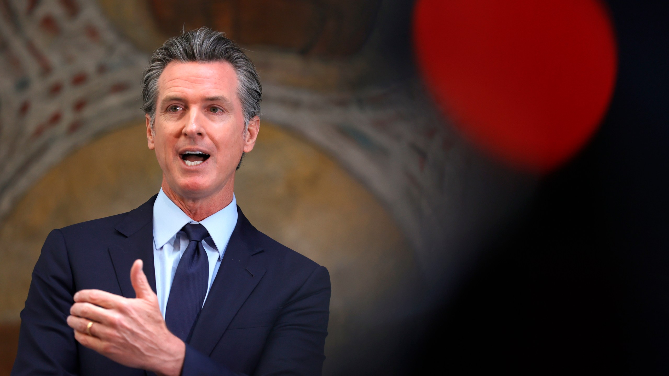 California Gov. Gavin Newsom speaks during a press conference at The Unity Council in Oakland on May 10, 2021. (Justin Sullivan / Getty Images)