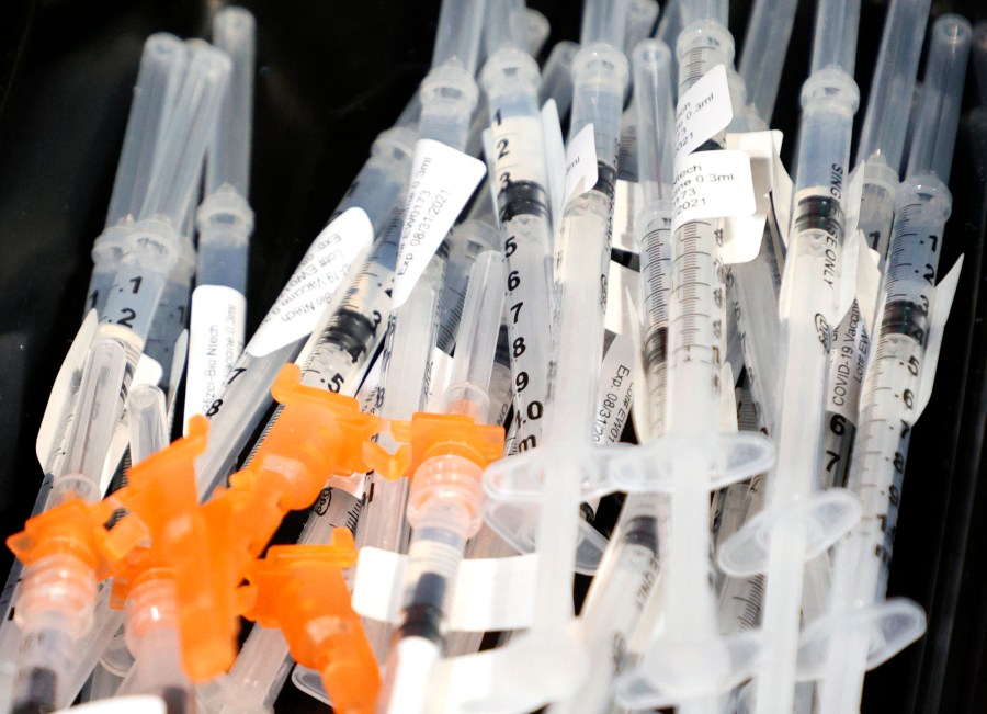 Syringes with the Pfizer-BioNTech COVID-19 vaccine are placed on a tray at a pop-up COVID-19 vaccination clinic at Larry Flynt's Hustler Club on May 21, 2021 in Las Vegas, Nevada. (Ethan Miller/Getty Images)