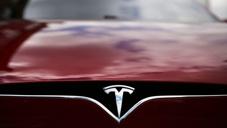 A Tesla model S sits parked outside of a new Tesla showroom and service center in Red Hook, Brooklyn, on July 5, 2016. (Spencer Platt / Getty Images)