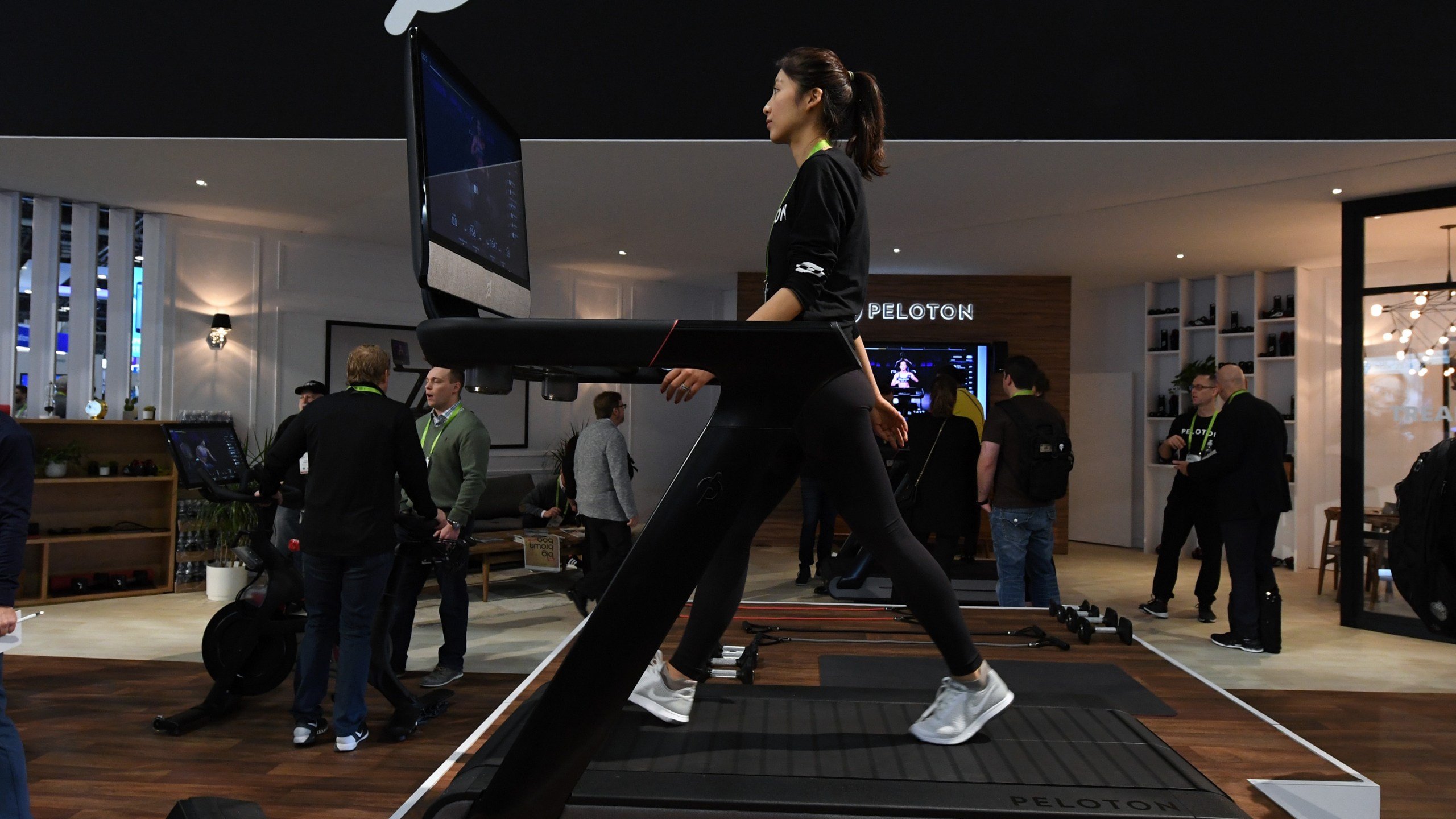 Maggie Lu uses a Peloton Tread treadmill during CES 2018 at the Las Vegas Convention Center on January 11, 2018 in Las Vegas, Nevada. (Ethan Miller/Getty Images)