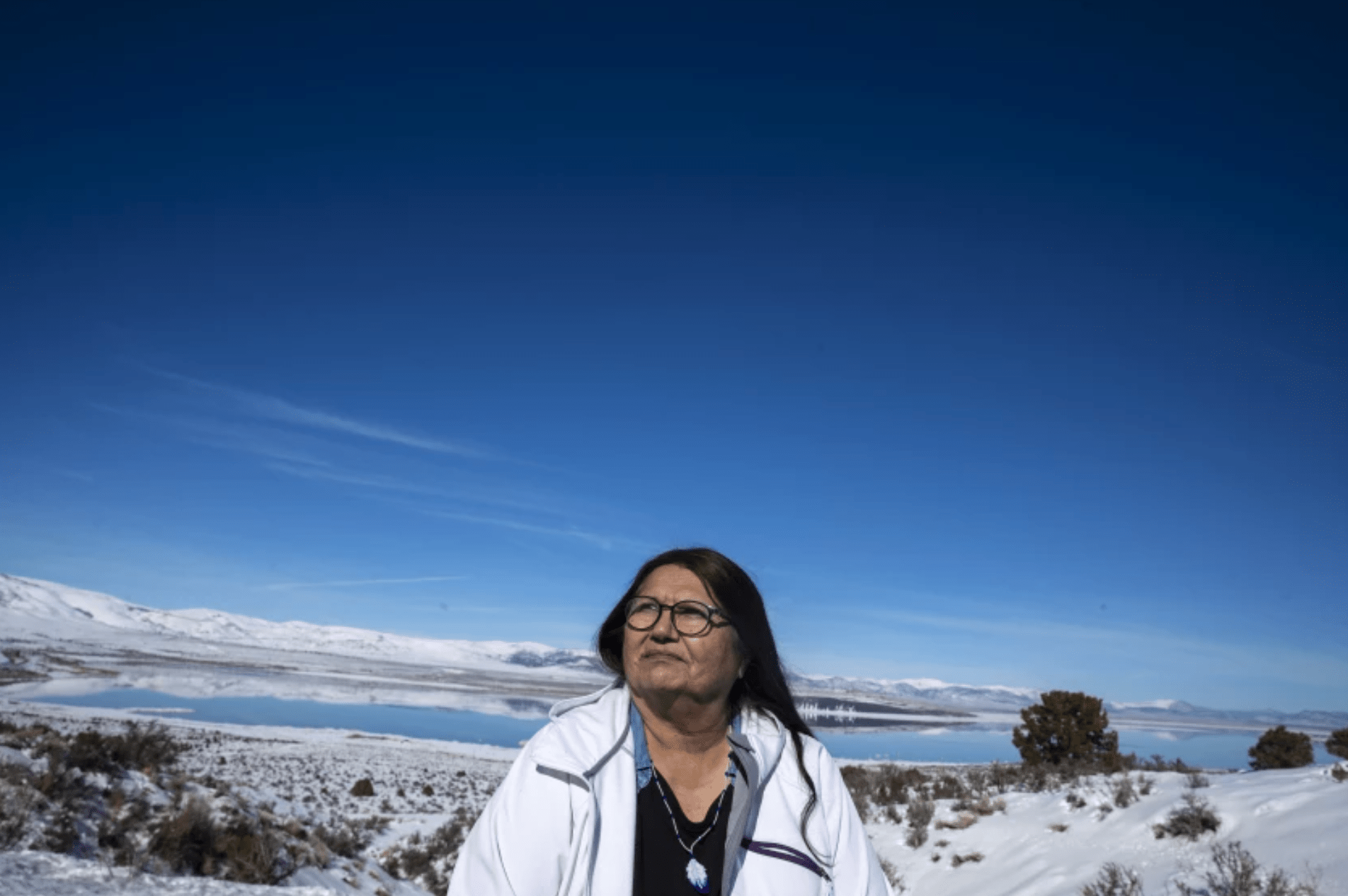 Charlotte Lange, 67, chairwoman of the Mono Lake Kutzadika Paiute tribe, sits for a portrait in February on a bluff in Lee Vining overlooking the lake. The tribe is among roughly two dozen unrecognized and landless tribes in California.(Brian van der Brug / Los Angeles Times)