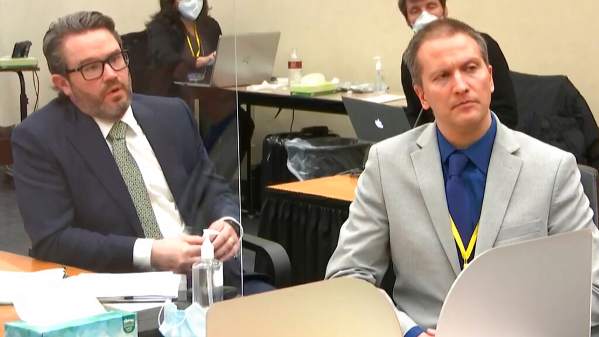 In this April 19, 2021, file image from video, defense attorney Eric Nelson, left, and defendant, former Minneapolis police officer Derek Chauvin, speak to Hennepin County Judge Peter Cahill. (Court TV via AP, Pool File)