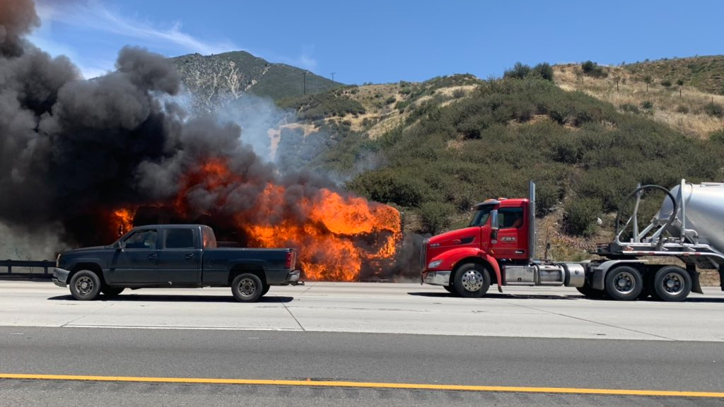 The Devore Fire burns along the Cajon Pass on Interstate 15 on May 4, 2021, in a photo released by Caltrans.