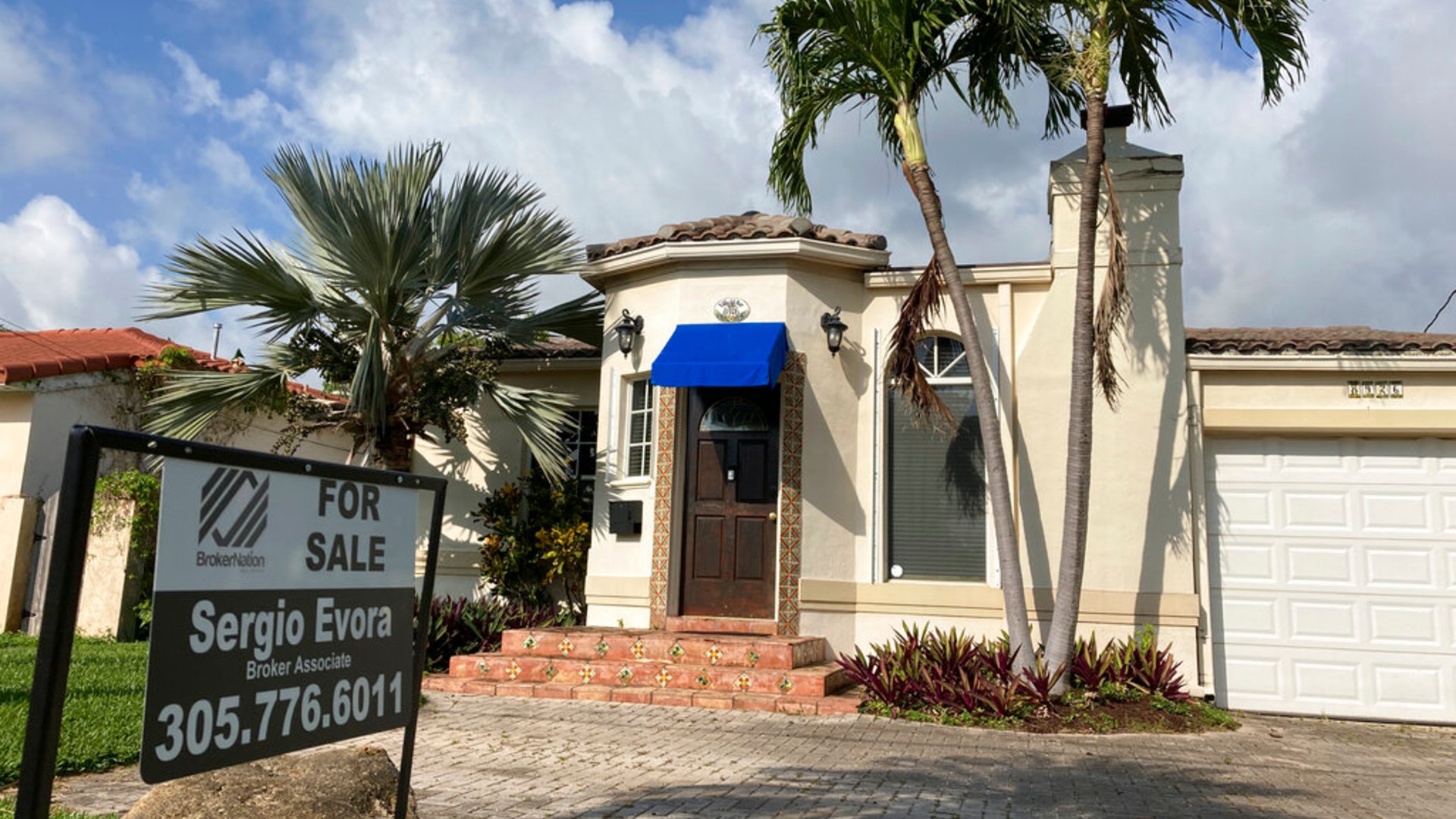 A home is shown for sale, Thursday, March 18, 2021, in Surfside, Fla. (AP Photo/Wilfredo Lee)