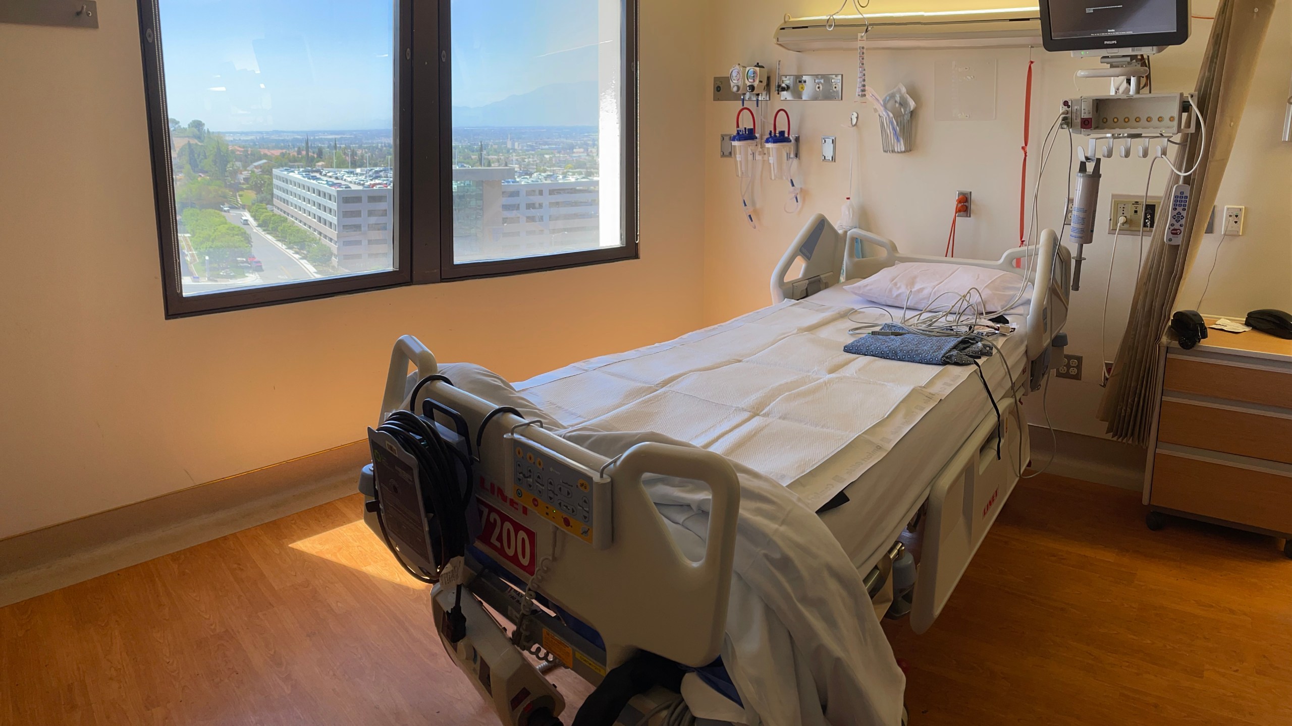 An empty hospital bed sits in the cardiac intensive care unit at Loma Linda University Medical Center in a May 5, 2021, photo released by the hospital. The ICU was one of many converted to a COVID-19 unit at the height of the pandemic.