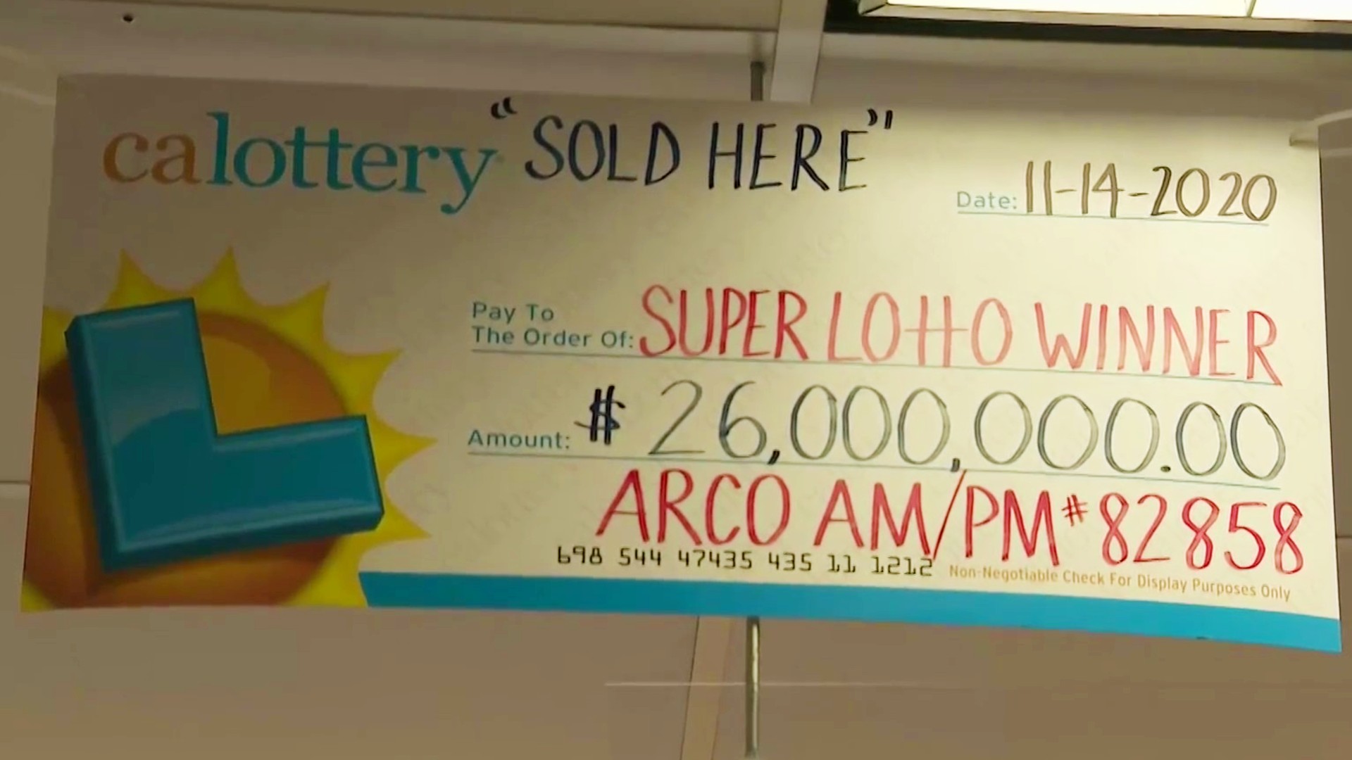 A sign advertising a winning SuperLotto Plus ticket sold in Norwalk is seen in this file image. (KTLA)