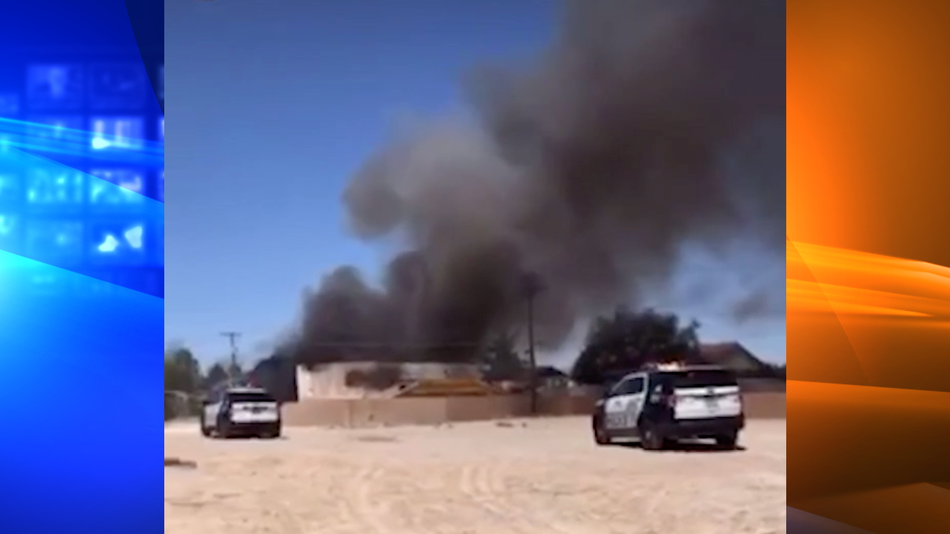 A still from cellphone video provided by Cristian Mendoza to KLAS shows smoke rising from a residential area outside Nellis Air Force Base, near Las Vegas, Nevada, after a plane crashed there on May 24, 2021.