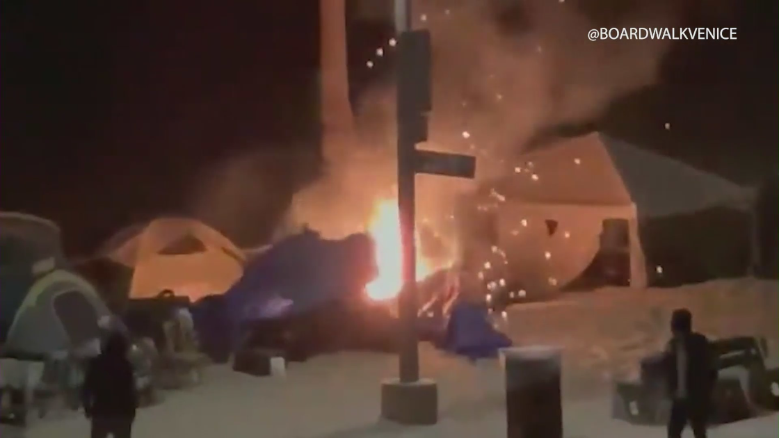 Video shared on the Twitter page @boardwalkvenice on May 5, 2021 shows a fire at a homeless camp along the boardwalk.