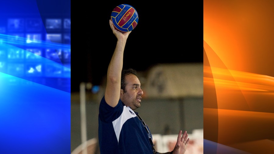 In this Sept. 23, 2013, file photo, Bahram Hojreh coaches youngsters at at the USA Water Polo National Training Center in Los Alamitos, Calif. (Rose Palmisano/The Orange County Register via AP, File)