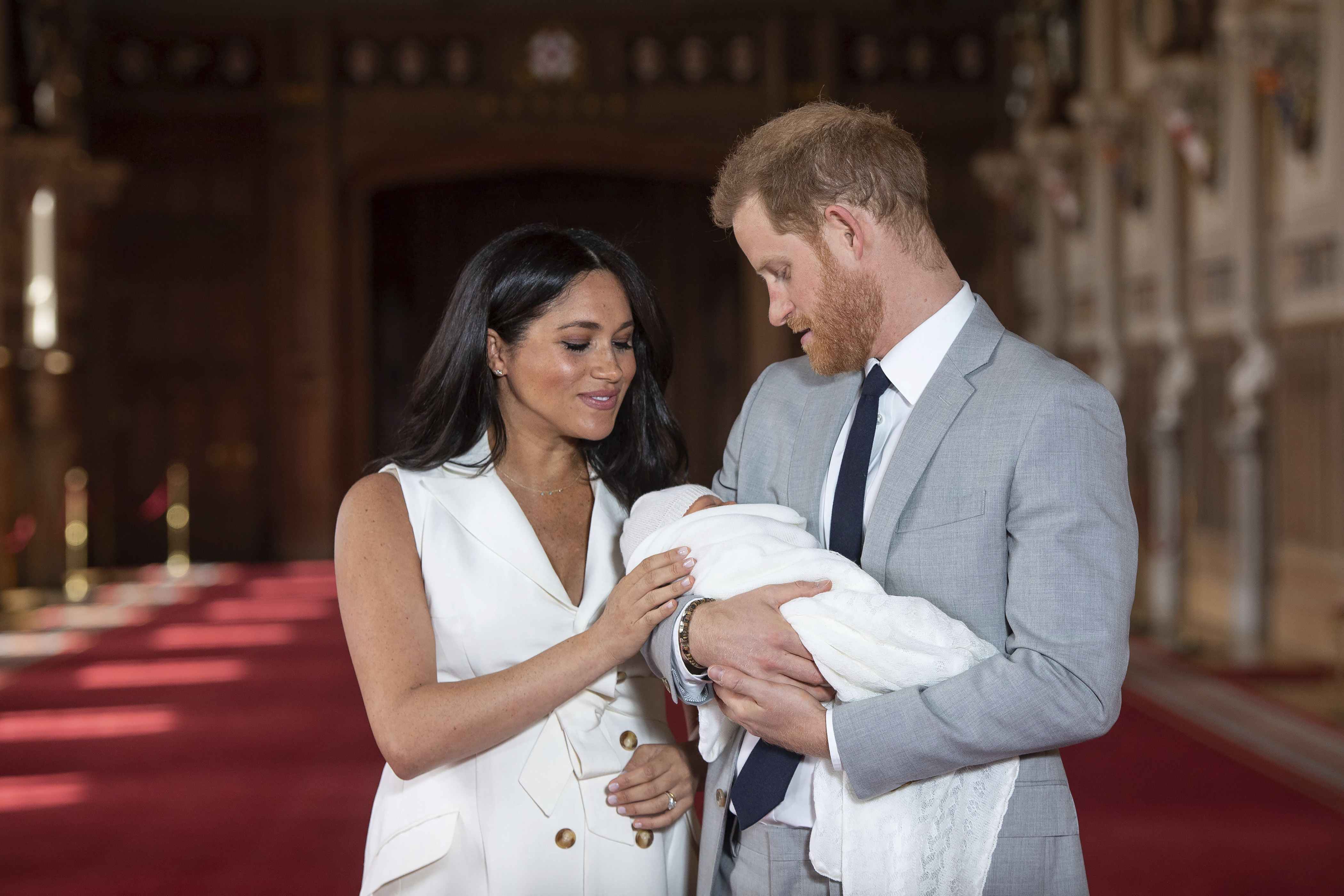 In this Wednesday May 8, 2019 file photo Britain's Prince Harry and Meghan, Duchess of Sussex, pose during a photocall with their newborn son Archie, in St George's Hall at Windsor Castle, Windsor, south England. (Dominic Lipinski/Pool via AP, file)