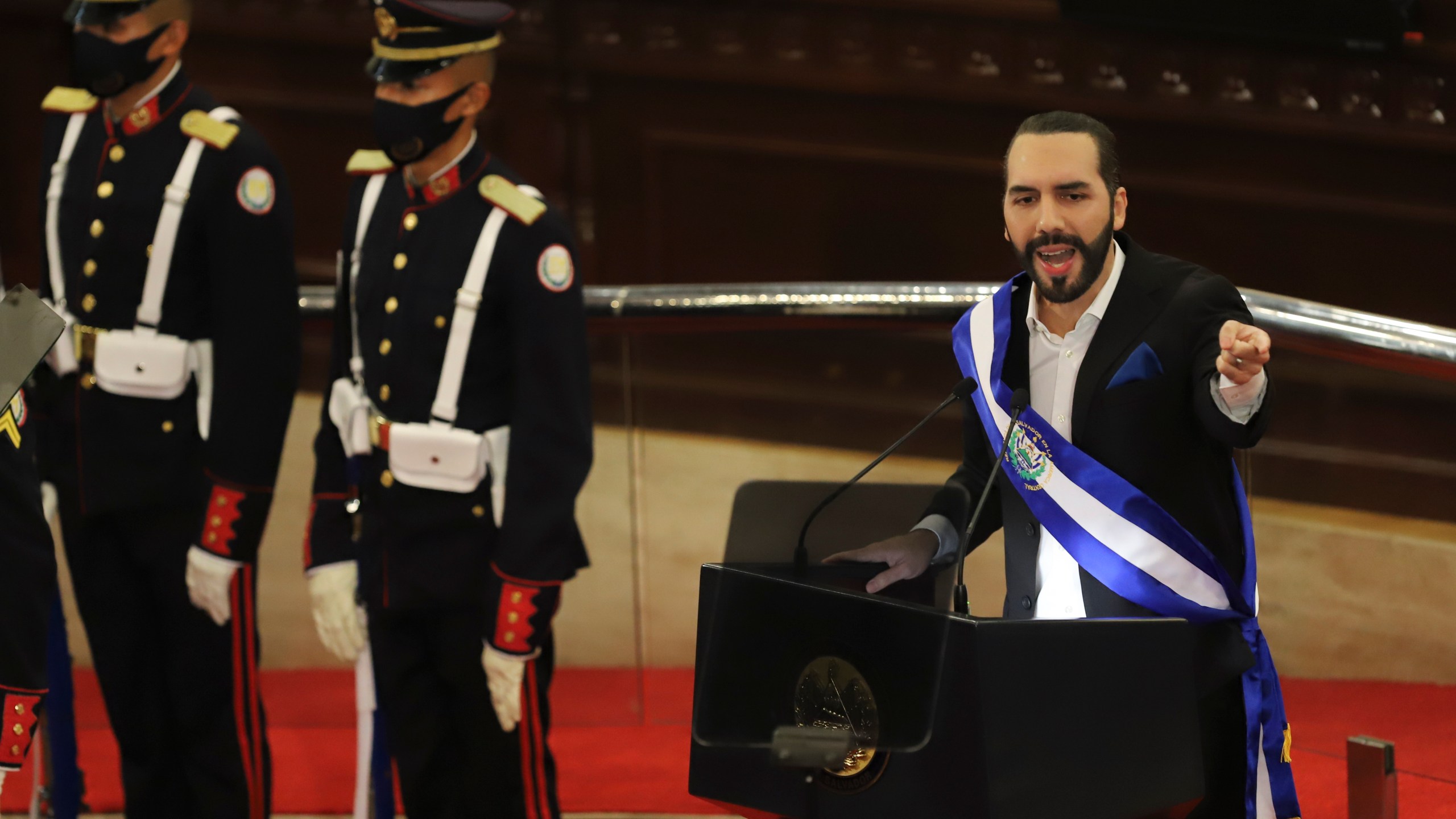 El Salvador's President Nayib Bukele delivers his annual address to the nation before Congress, in San Salvador, El Salvador, Tuesday, June 1, 2021. (AP Photo/Salvador Melendez)