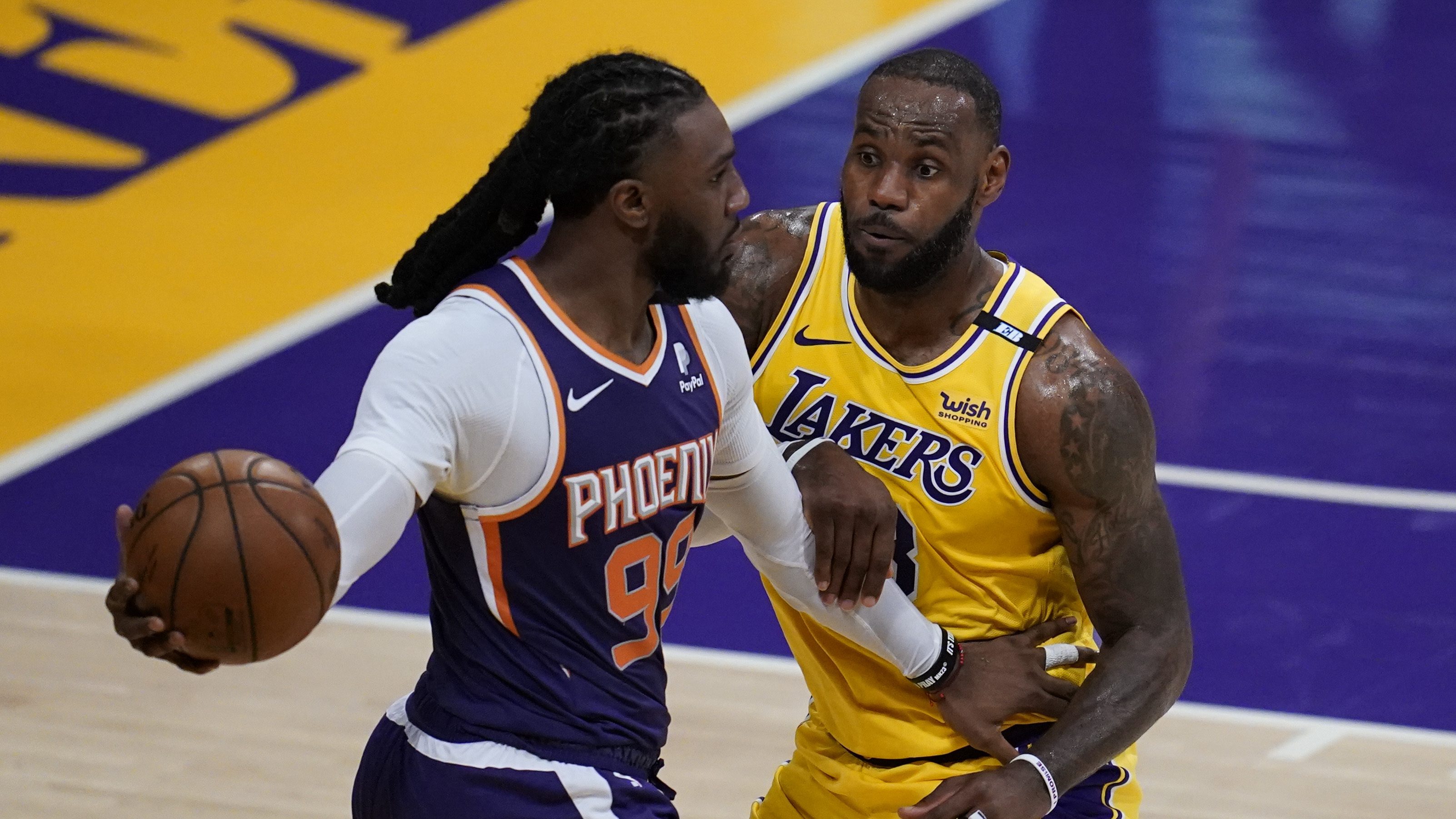 Los Angeles Lakers forward LeBron James (23) defends against Phoenix Suns forward Jae Crowder (99) during the second quarter of Game 6 of an NBA basketball first-round playoff series in Los Angeles on June 3, 2021. (Ashley Landis / Associated Press)