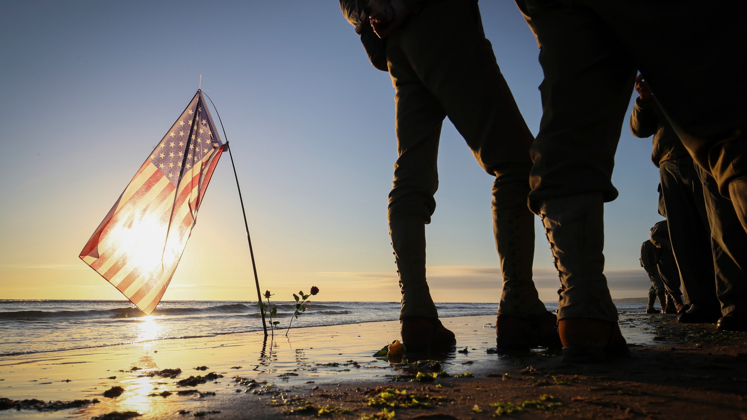 World War II reenactors gather on Omaha Beach in Saint-Laurent-sur-Mer, Normandy, Sunday, June 6, 2021, the day of 77th anniversary of the assault that helped bring an end to World War II. (AP Photo/David Vincent)