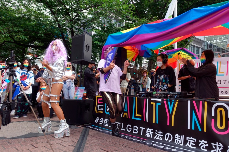 Dozens of LGBTQ activists and supporters of equal rights laws gather at the Shibuya district Sunday June 6, 2021, in Tokyo. (AP Photo/Mari Yamaguchi)